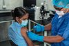 Woman getting vaccine shot.