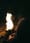 Woman watching fire.